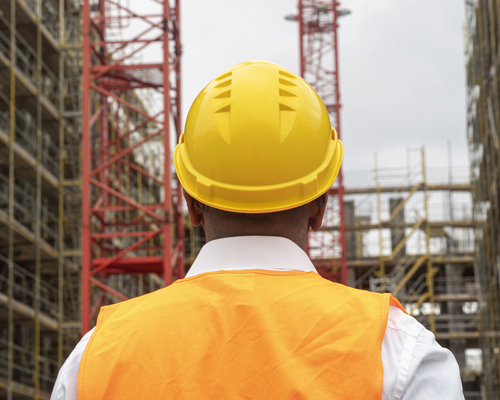 HSE Statistics 2024/25: Image of a worker wearing a hardhat on a construction site